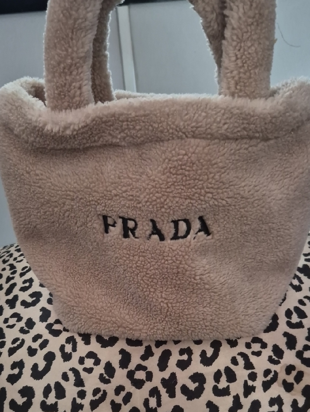 Prada Beige Faux Shearling Tote with Black Logo
